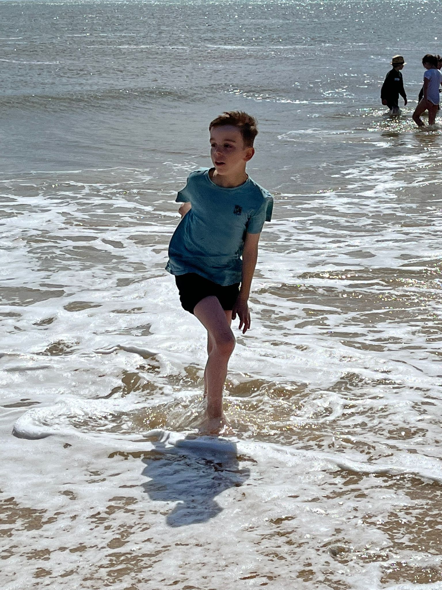 student in the water at the beach