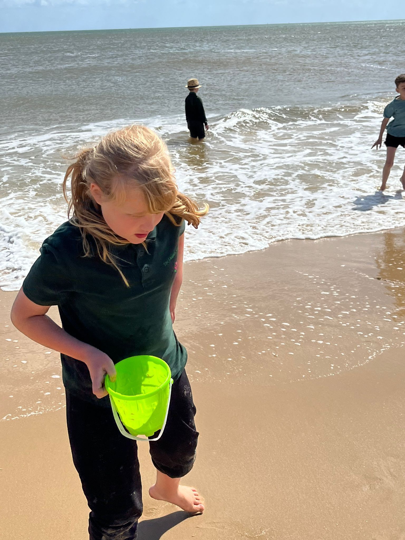 student playing with sand