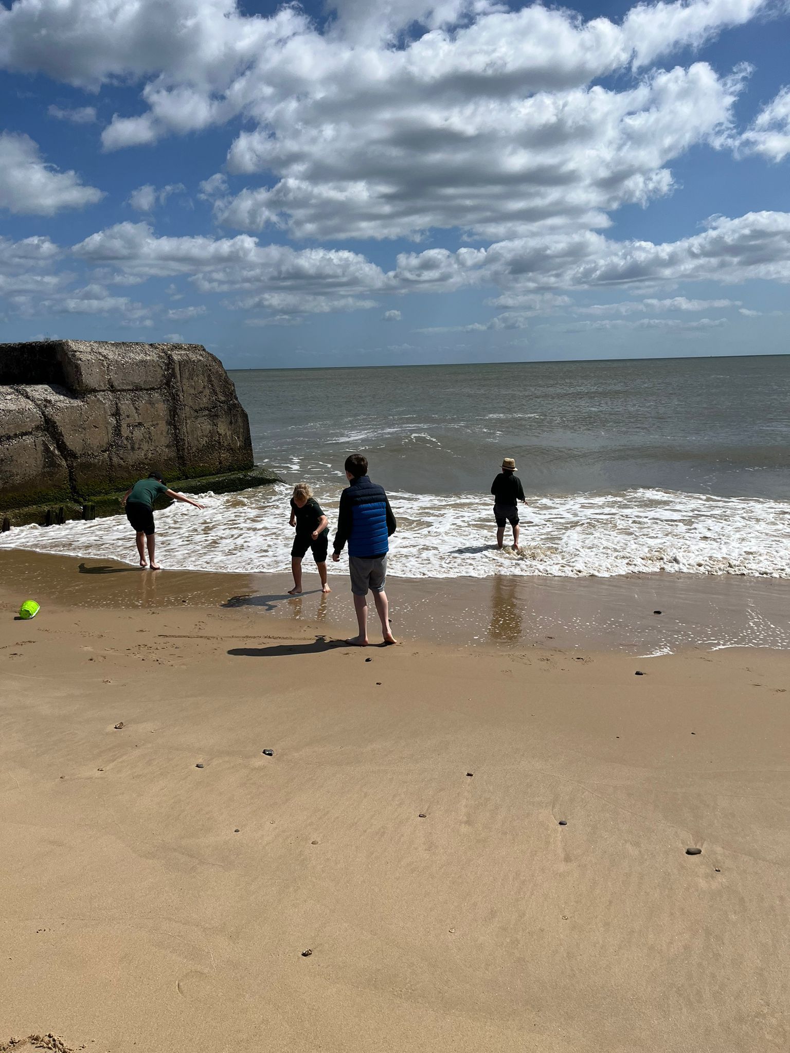 students hanging out at the beach
