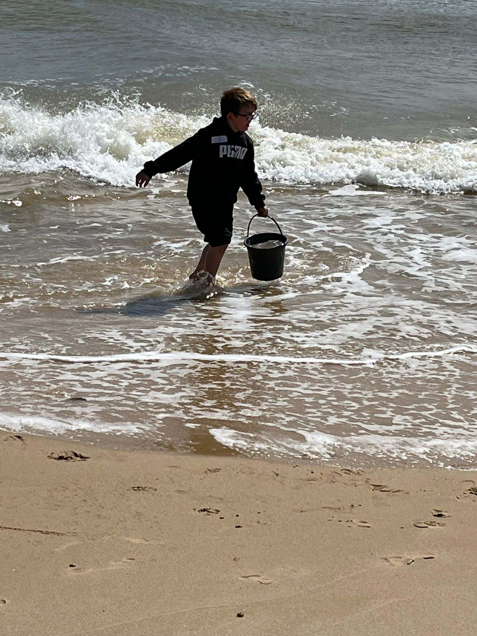 student at the beach playing