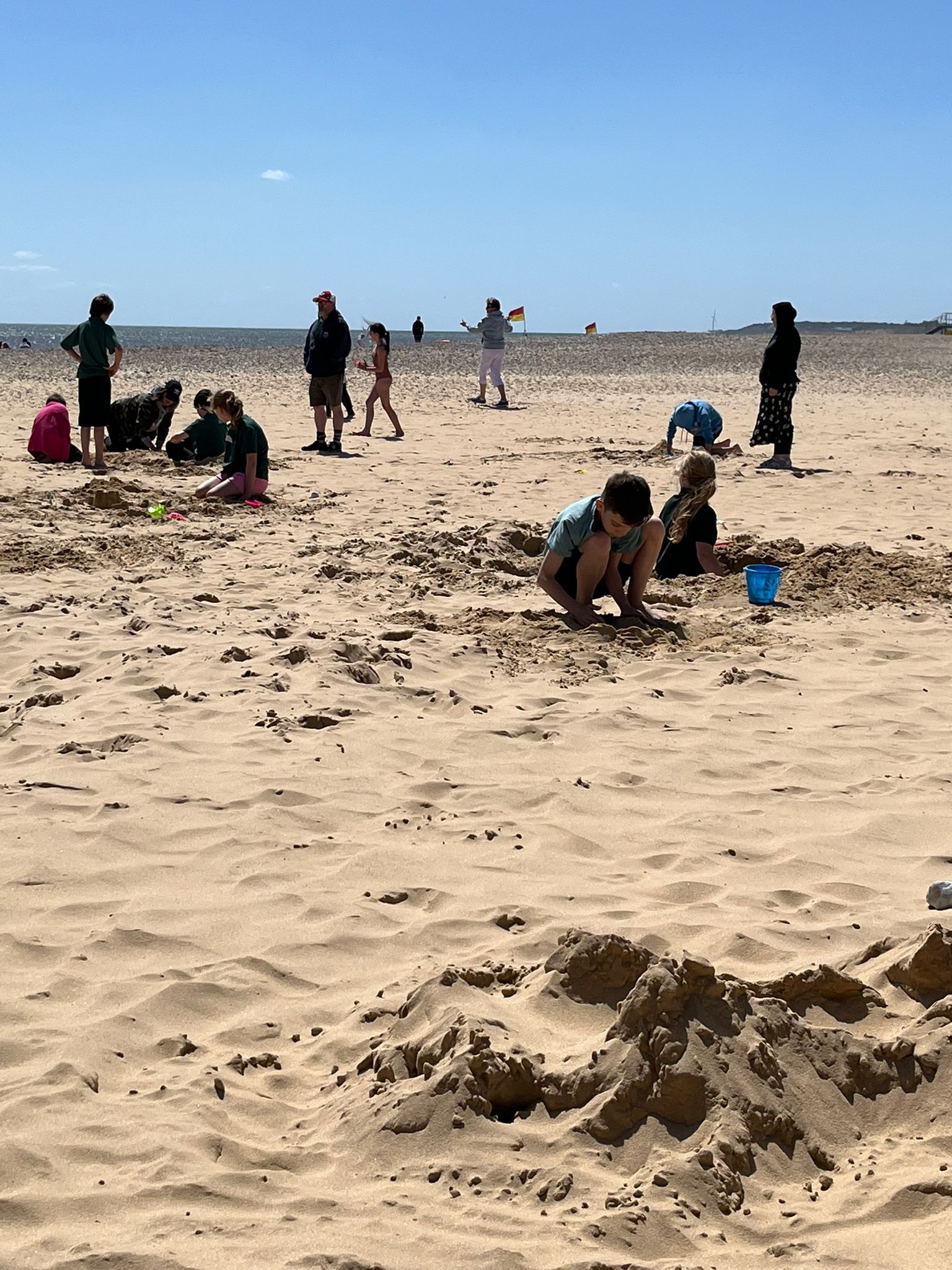 students playing in the sand