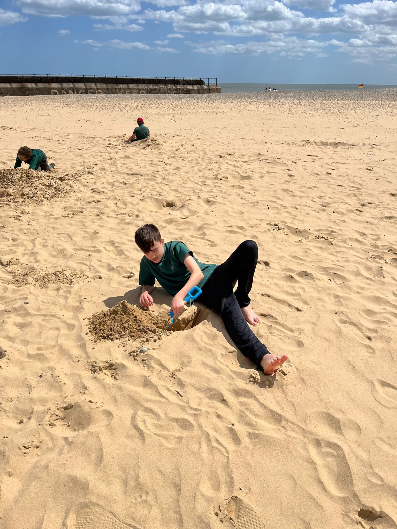 students playing in the sand