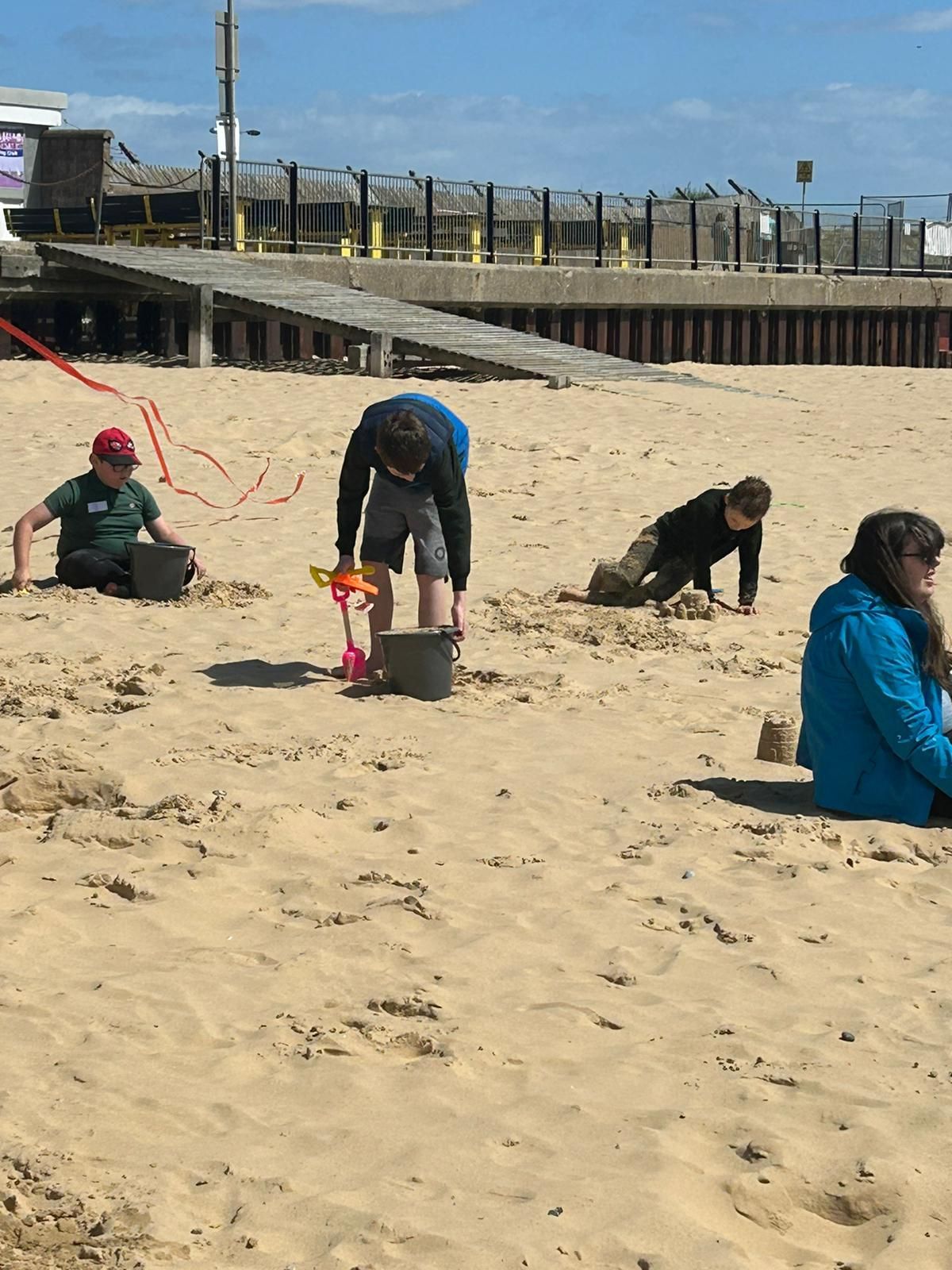 students playing in the sand