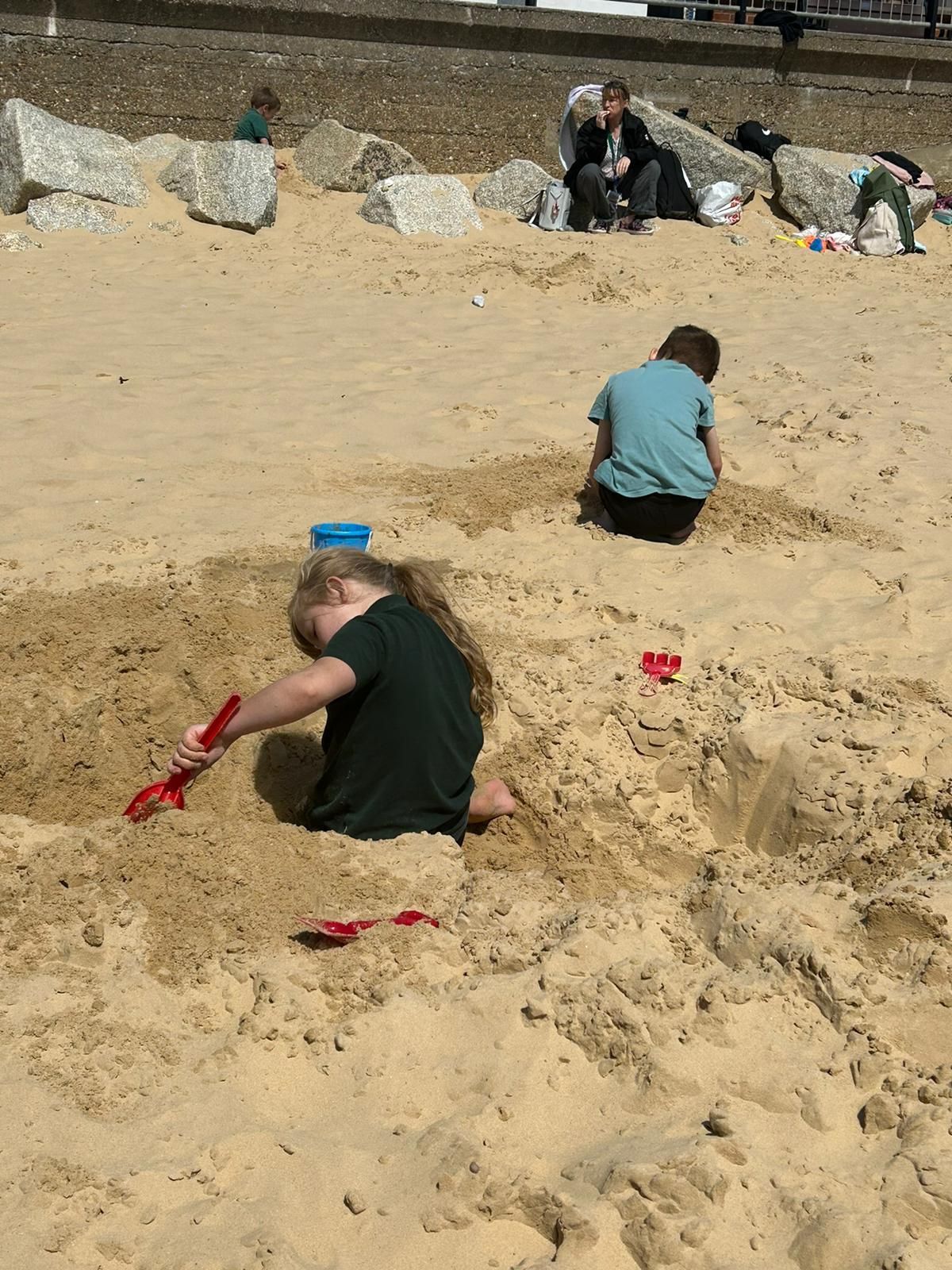 students playing in the sand