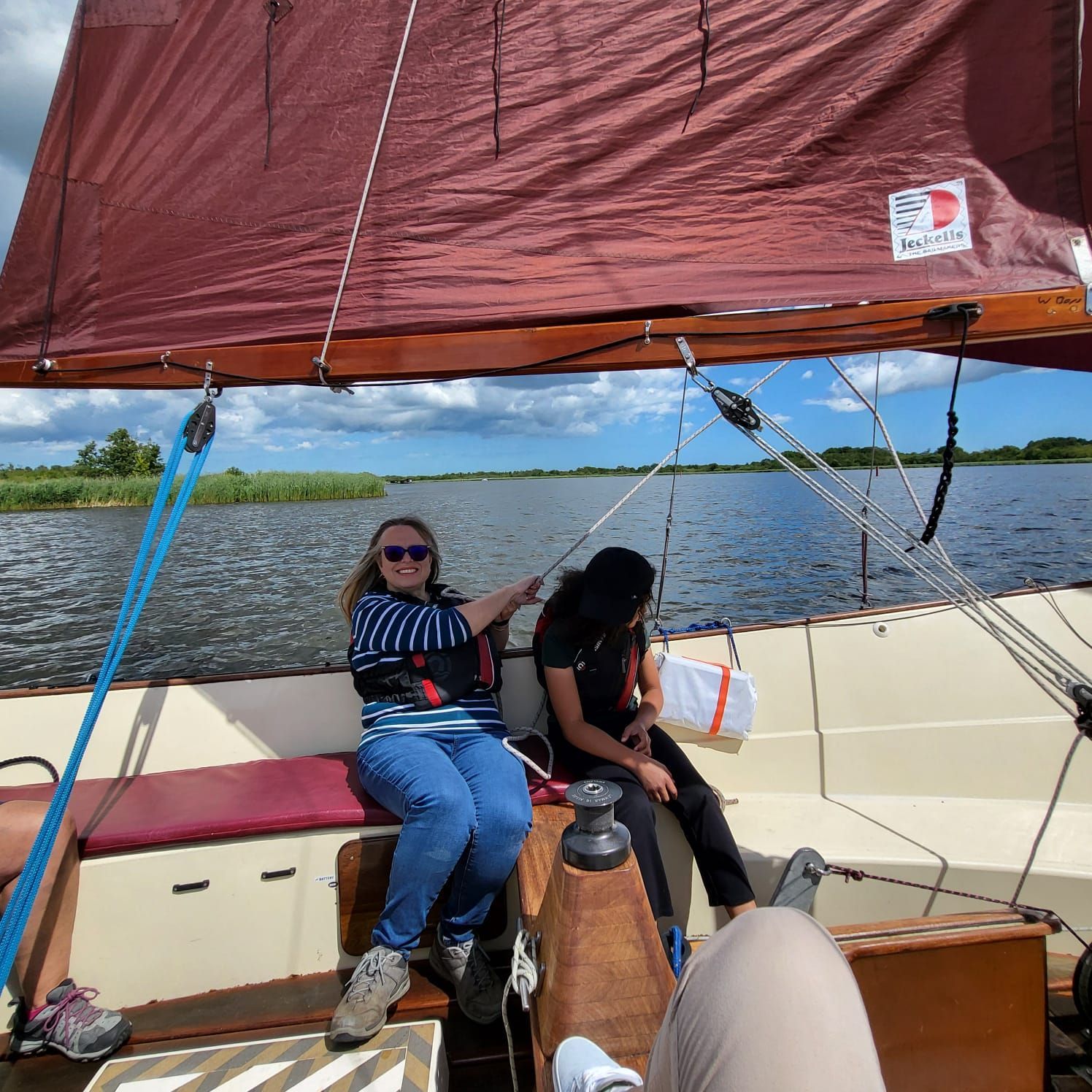 students and staff on a boat