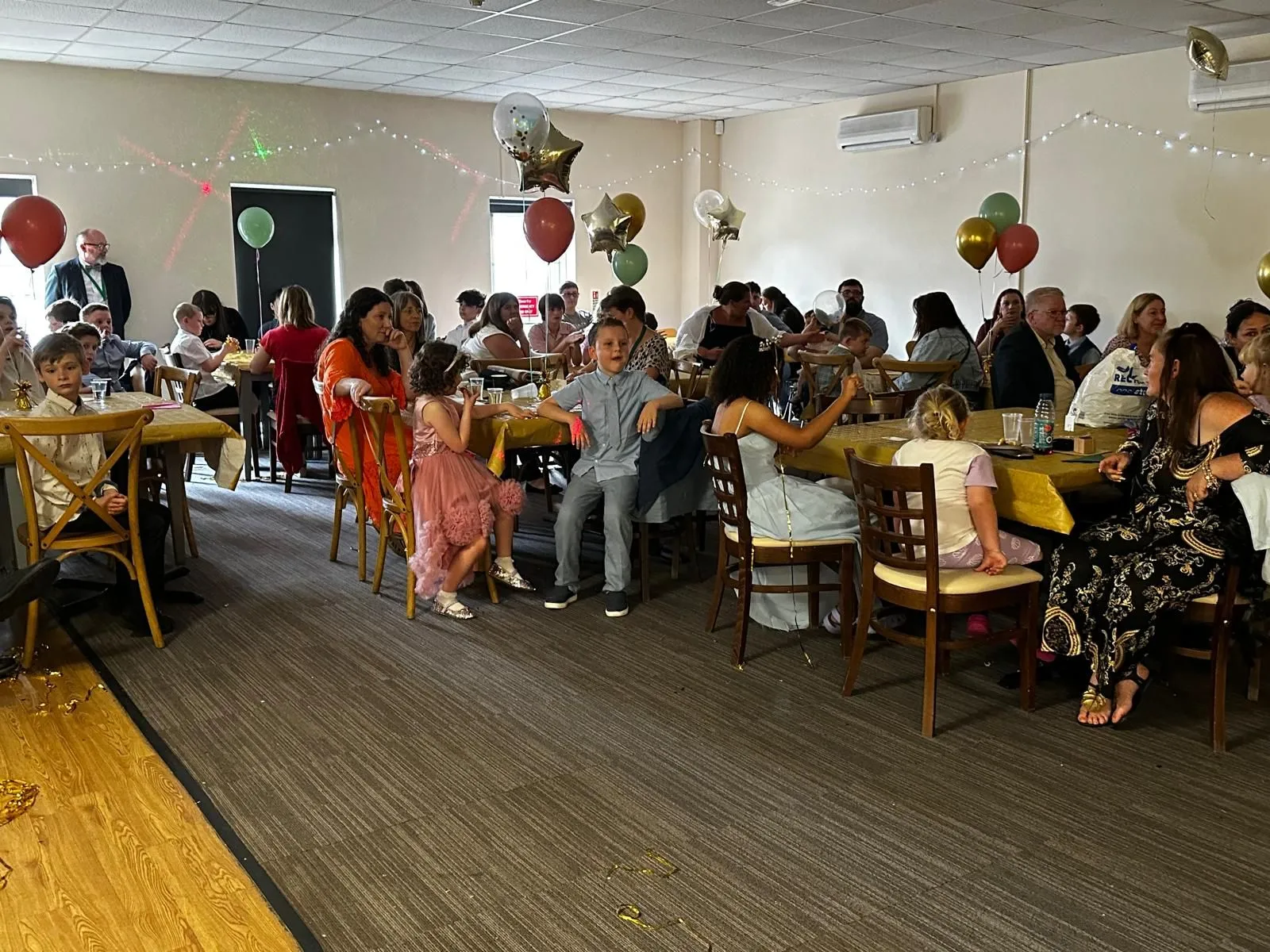 Students, parents and staff at prom