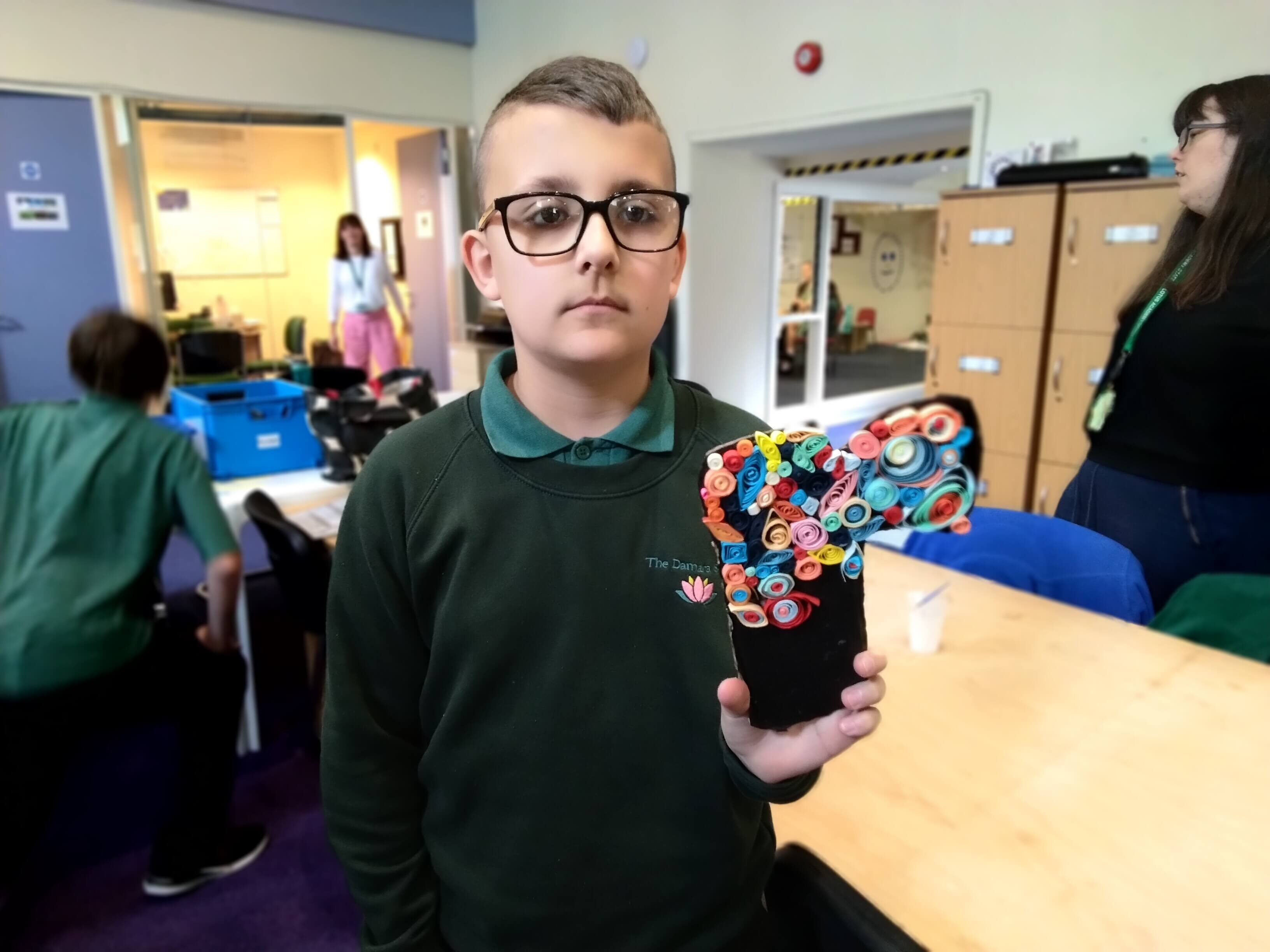 Student showing artwork